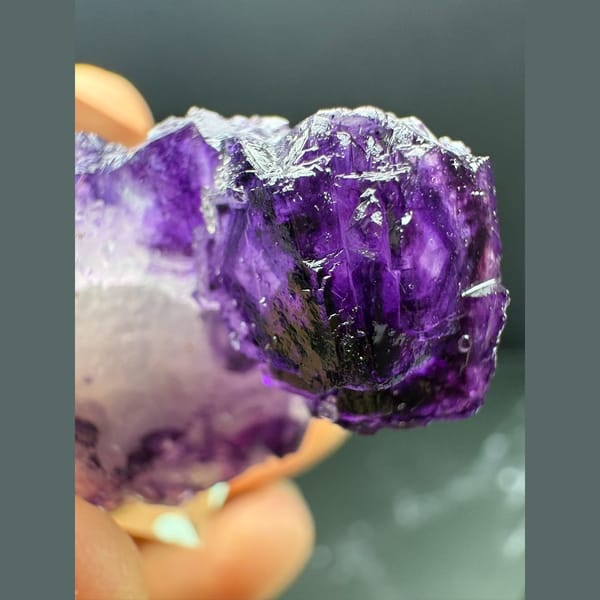 Small deep purple fluorite crystal on white quartz from Luoyang — alternate view