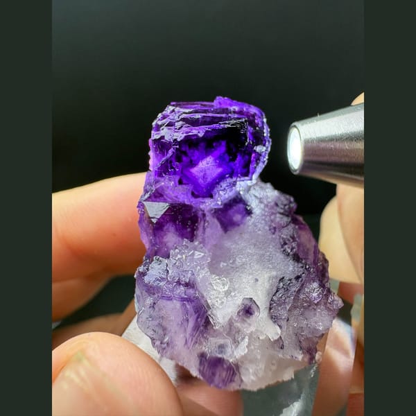 Small deep purple fluorite crystal on white quartz from Luoyang — detail view