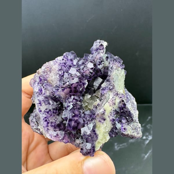 Purple fluorite with pale-windowed faces and candle quartz from Luoyang — complete view