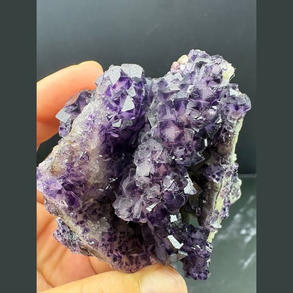 Purple fluorite with pale-windowed faces and candle quartz from Luoyang — alternate view