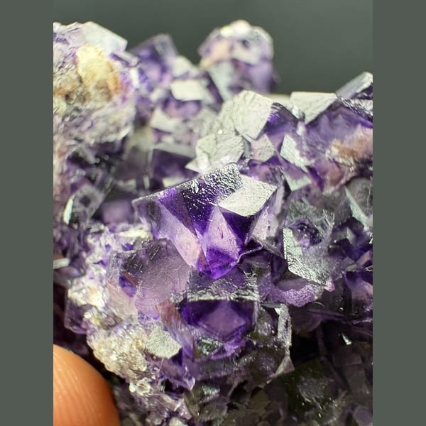 Purple fluorite with pale-windowed faces and candle quartz from Luoyang — alternate view