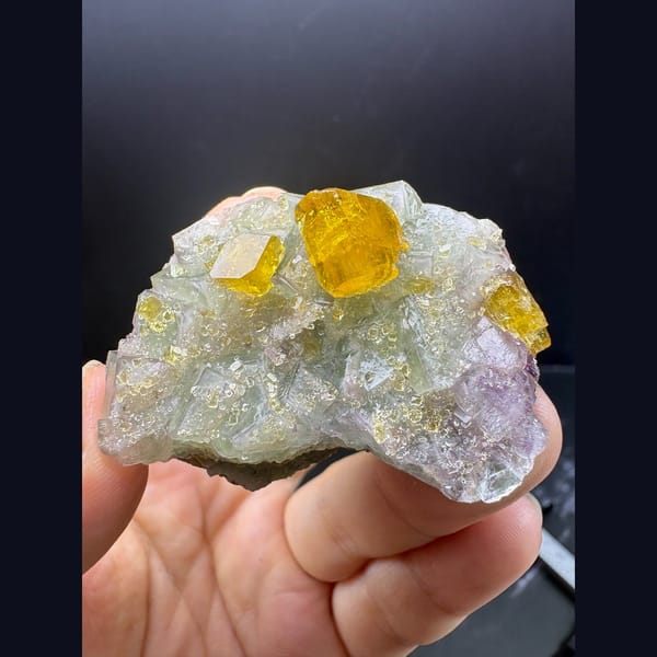 Golden yellow barite crystals on pale green fluorite from Ruijin — complete view