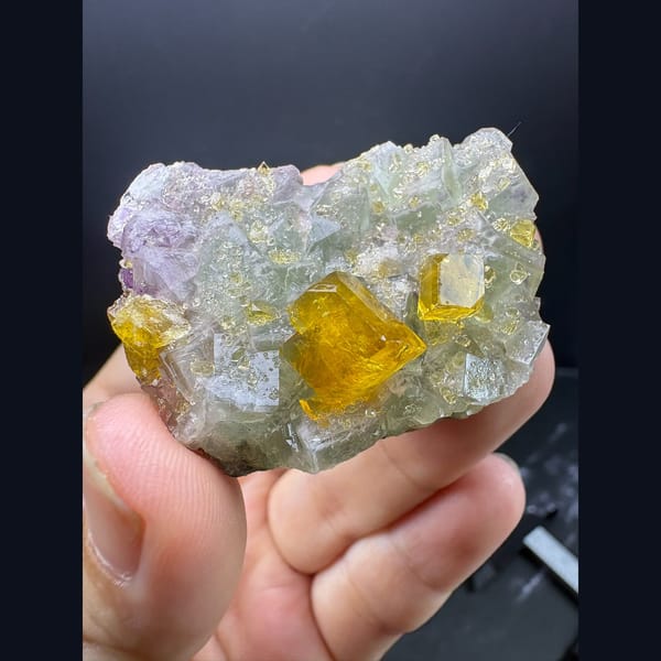 Golden yellow barite crystals on pale green fluorite from Ruijin — alternate view