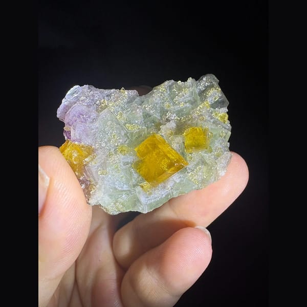 Golden yellow barite crystals on pale green fluorite from Ruijin — detail view