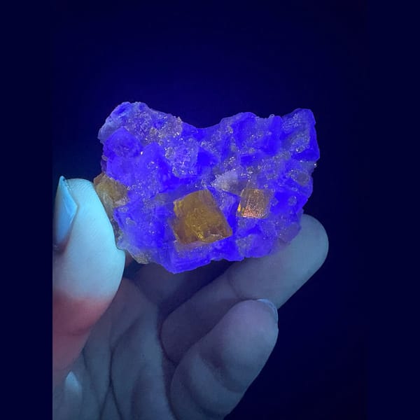 Golden yellow barite crystals on pale green fluorite from Ruijin — detail view