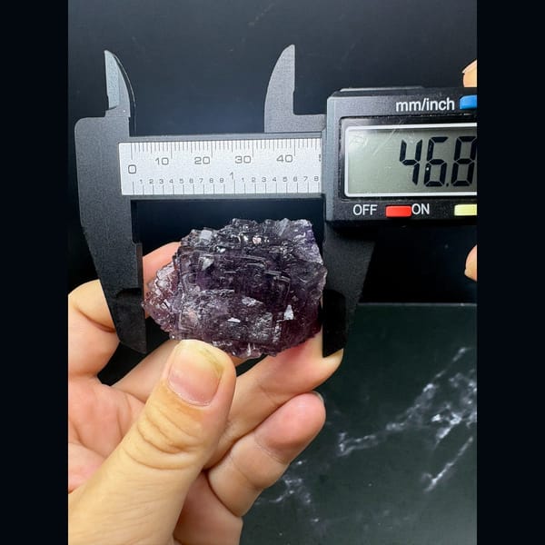 Stepped, flower-like purple fluorite crystal from Henan — detail view