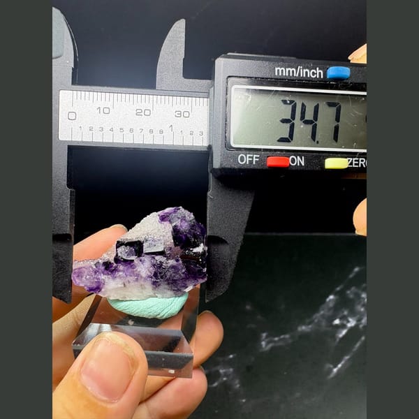 Deep purple fluorite cubes with white sugary druse from Henan — detail view