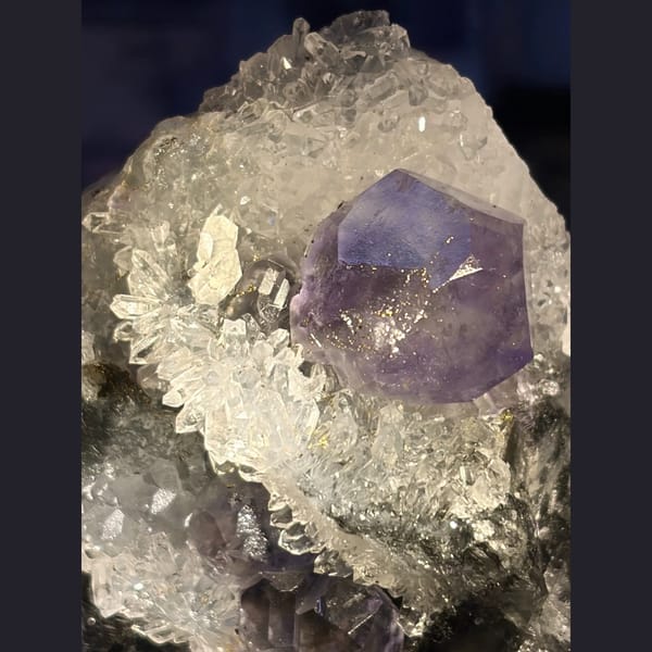 Large blue fluorite crystal on quartz cluster from Fujian — alternate view