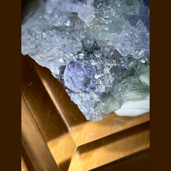 Large blue fluorite crystal on quartz cluster from Fujian — detail view