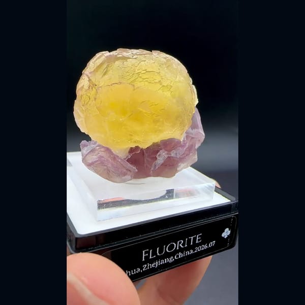Yellow fluorite ball on purple fluorite from Zhejiang — complete view