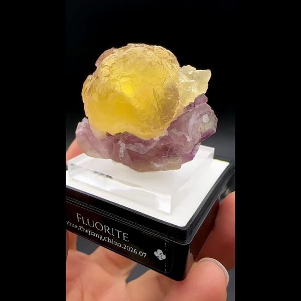 Yellow fluorite ball on purple fluorite from Zhejiang — alternate view