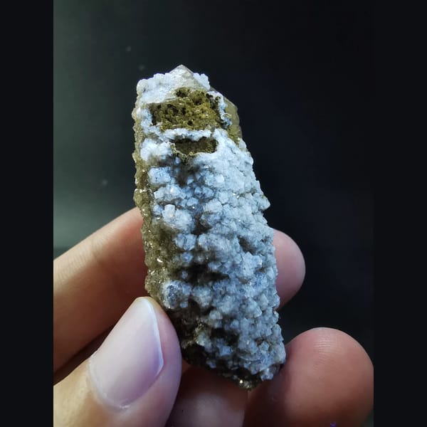 Quartz crystal covered in sparkling fluorite — alternate view