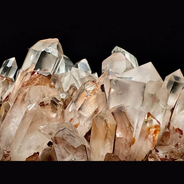 Large clear quartz cluster with red iron coating from Madagascar — alternate view