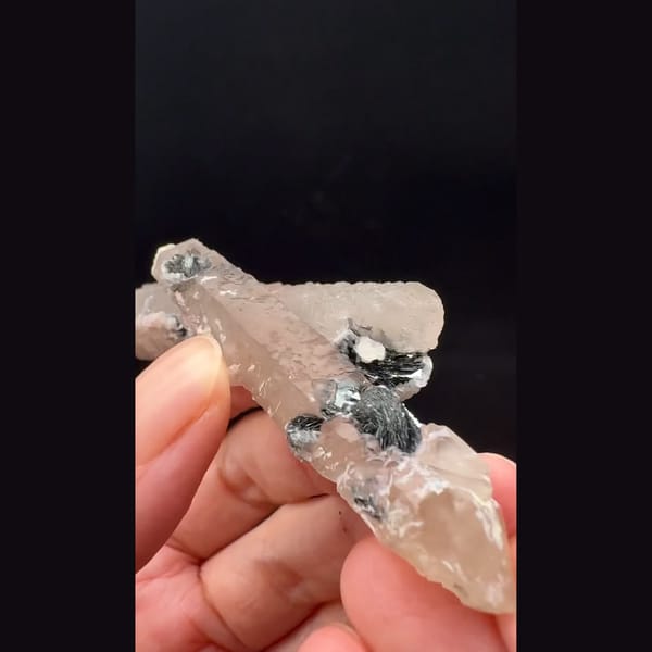 Double-terminated quartz with pink calcite and hematite rosette from Inner Mongolia — alternate view