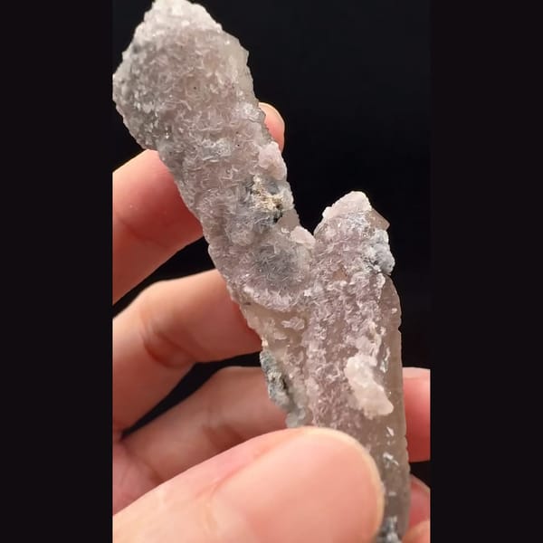 Double-terminated quartz with pink calcite and hematite rosette from Inner Mongolia — detail view