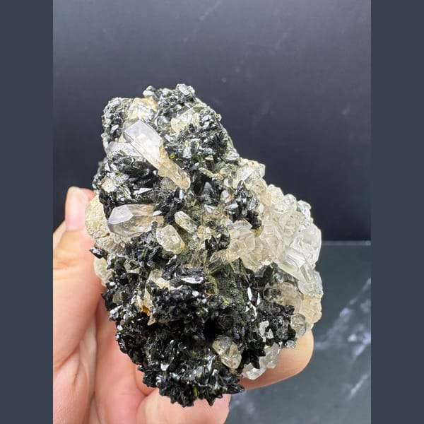 Pale prehnite clusters with dark epidote and quartz from Yunnan — alternate view