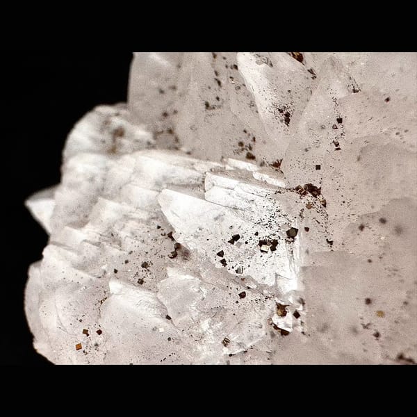Pale pink petal calcite with pyrite from Shizhuyuan, Hunan — alternate view