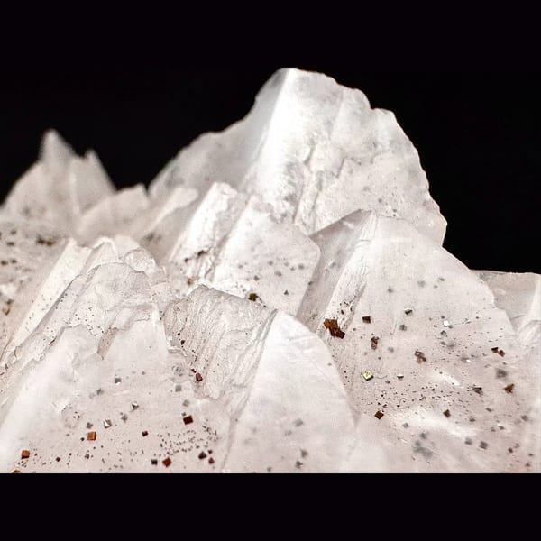 Pale pink petal calcite with pyrite from Shizhuyuan, Hunan — detail view