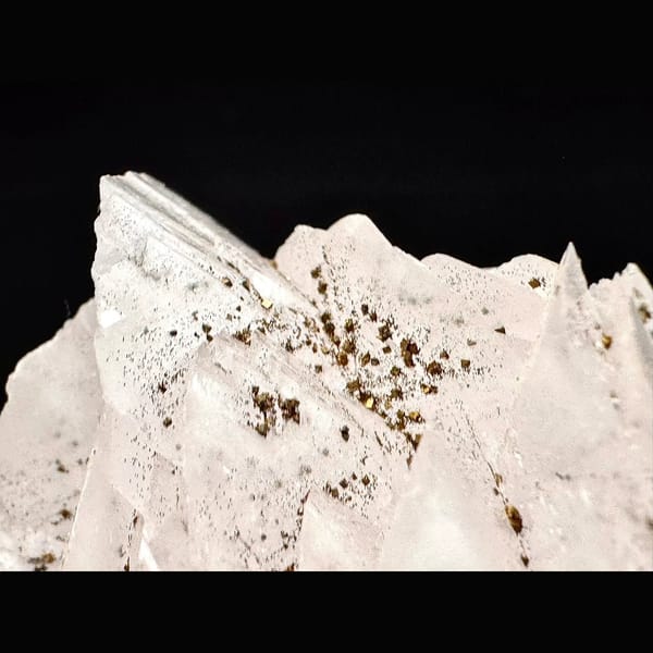 Pale pink petal calcite with pyrite from Shizhuyuan, Hunan — detail view