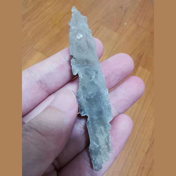 Irregular etched quartz crystal — complete view