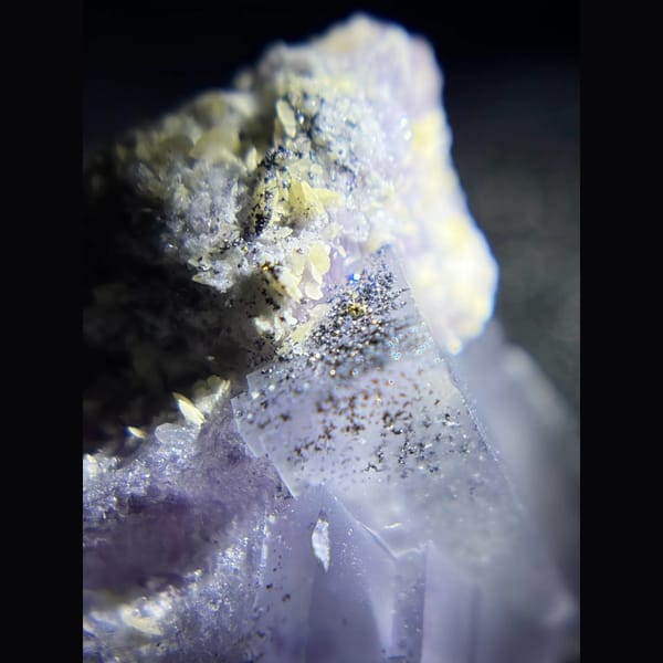 Purple fluorite with pyrite and mica from Yaogangxian — detail view