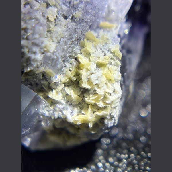 Purple fluorite with pyrite and mica from Yaogangxian — detail view