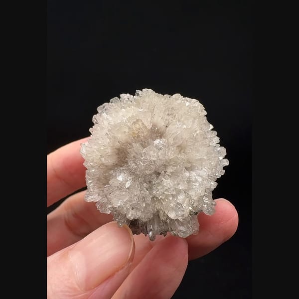 Ball of radiating glassy creedite crystals from Guizhou — complete view