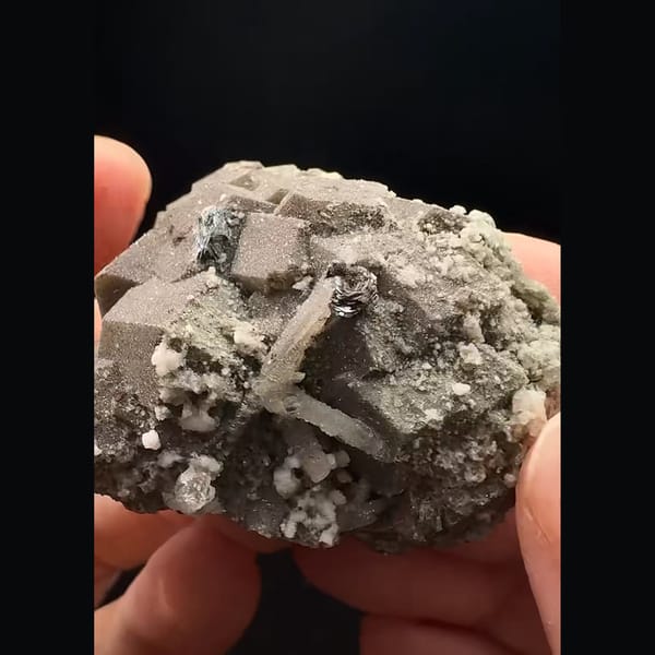 Brown andradite garnet with quartz and calcite from Inner Mongolia — detail view
