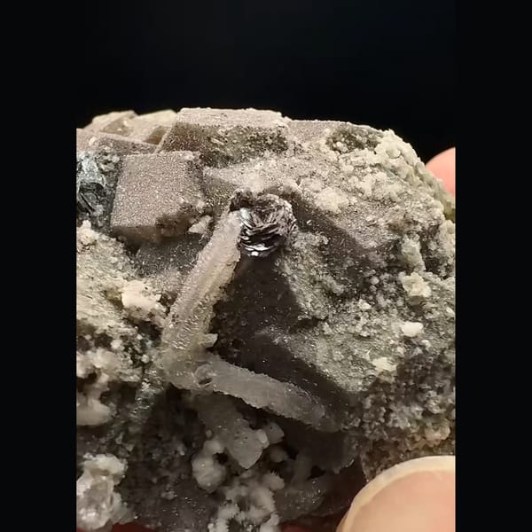 Brown andradite garnet with quartz and calcite from Inner Mongolia — detail view