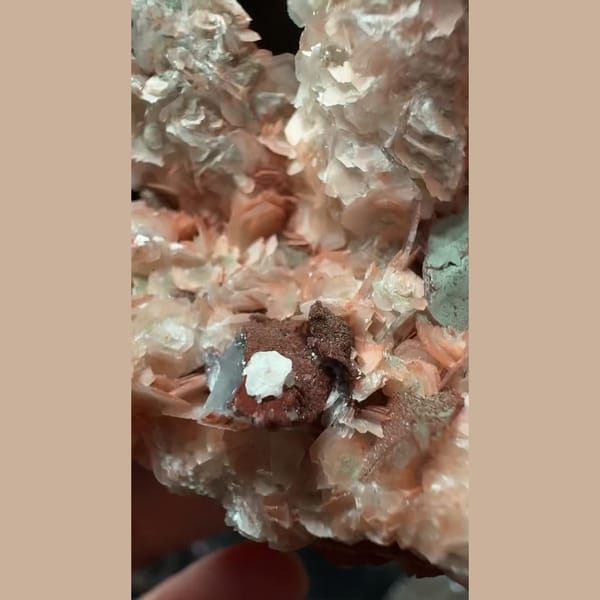 Sparkly quartz with salmon-pink petal calcite from Inner Mongolia — detail view