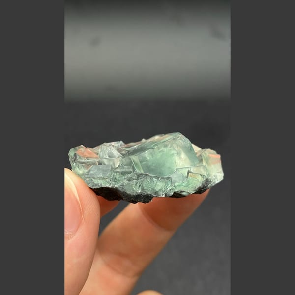 Glassy blue-green seaweed fluorite from Hunan — detail view