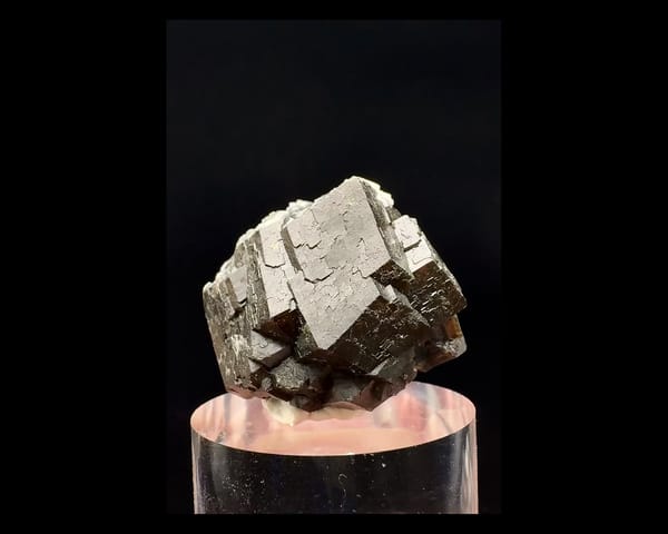 Complete front of the brown andradite garnet cluster showing broad stepped crystal faces, Inner Mongolia