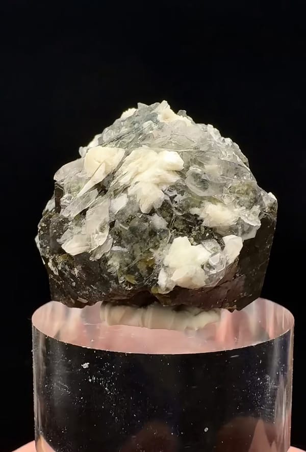 Complete reverse showing pale associated crystals over the same brown andradite garnet specimen