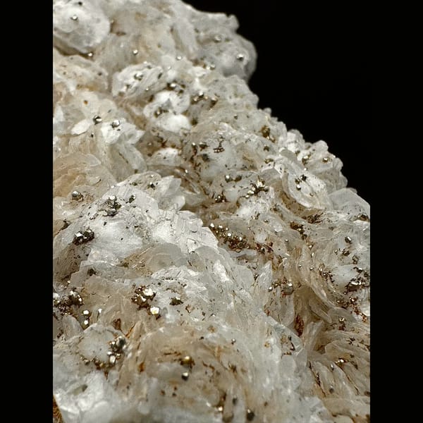 Broad sparkly quartz with white petal calcite and pyrite from Inner Mongolia — detail view