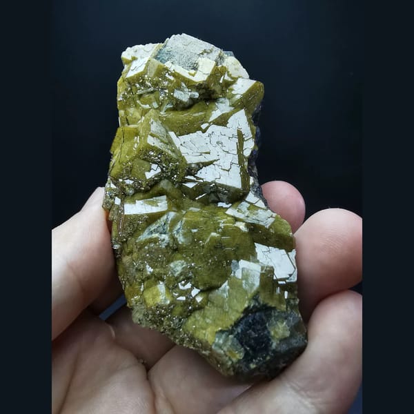Golden-yellow garnet with secondary growth faces — complete view