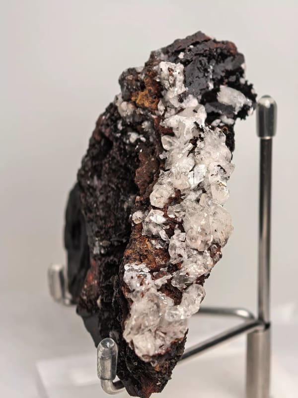Calcite Crystals on Dark Limonite Ridge — Guizhou — individual mineral specimen view 1