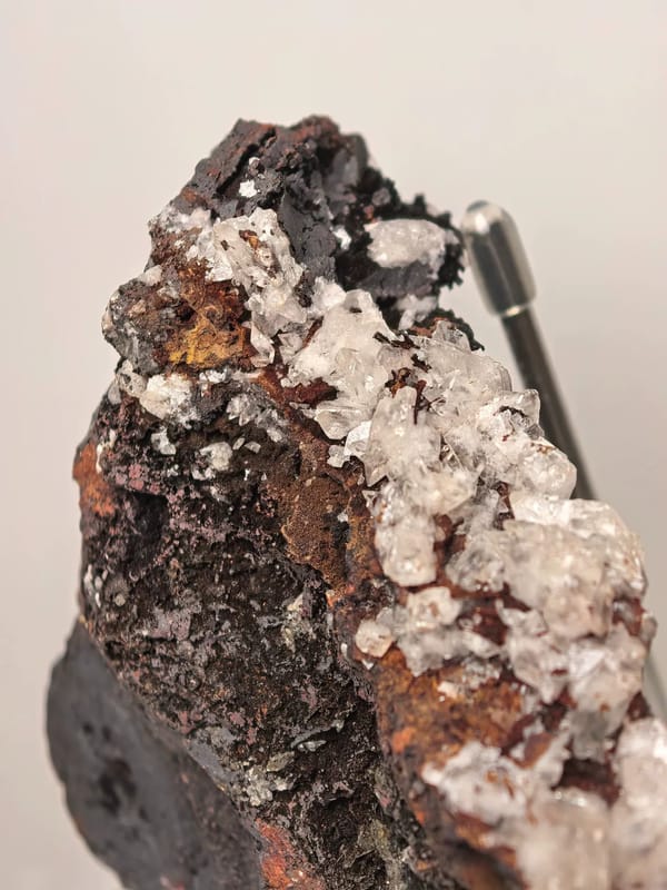 Calcite Crystals on Dark Limonite Ridge — Guizhou — individual mineral specimen view 2