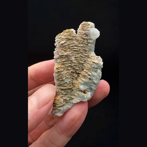 Small layered calcite floater from Inner Mongolia — alternate view