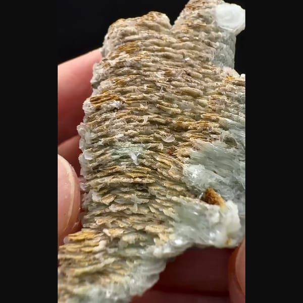 Small layered calcite floater from Inner Mongolia — alternate view