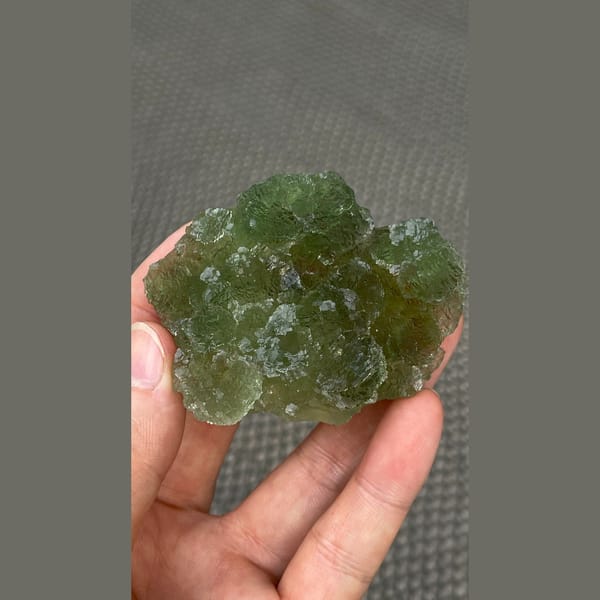 Flat stepped apple green fluorite plate from Henan — detail view