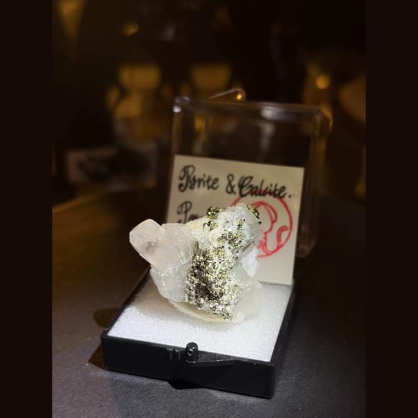 Metallic pyrite with clear calcite from Peru — complete view