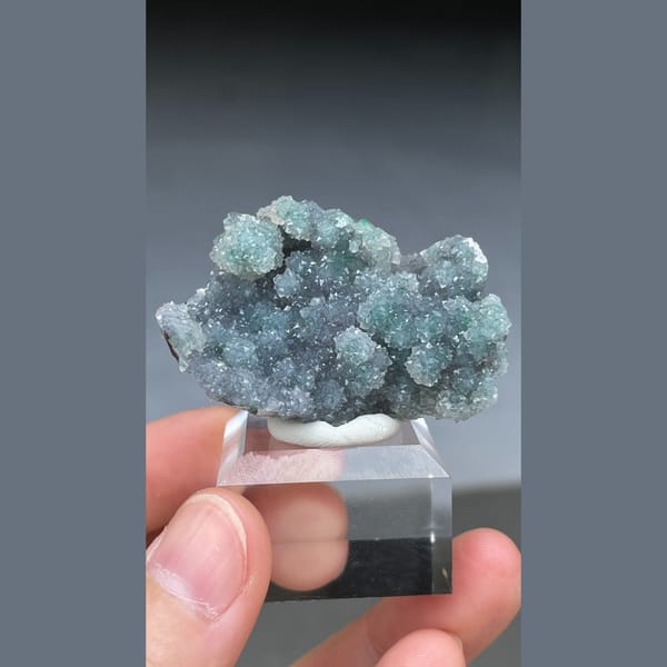 Rounded malachite spheres coated with quartz from the Congo — alternate view