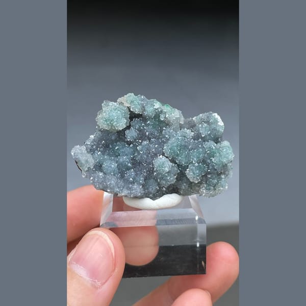 Rounded malachite spheres coated with quartz from the Congo — alternate view