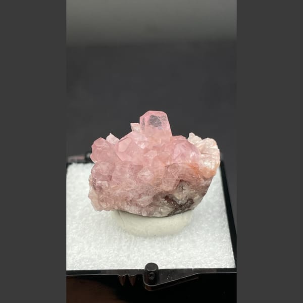 Bright pink cobaltoan calcite crystals from Morocco — complete view