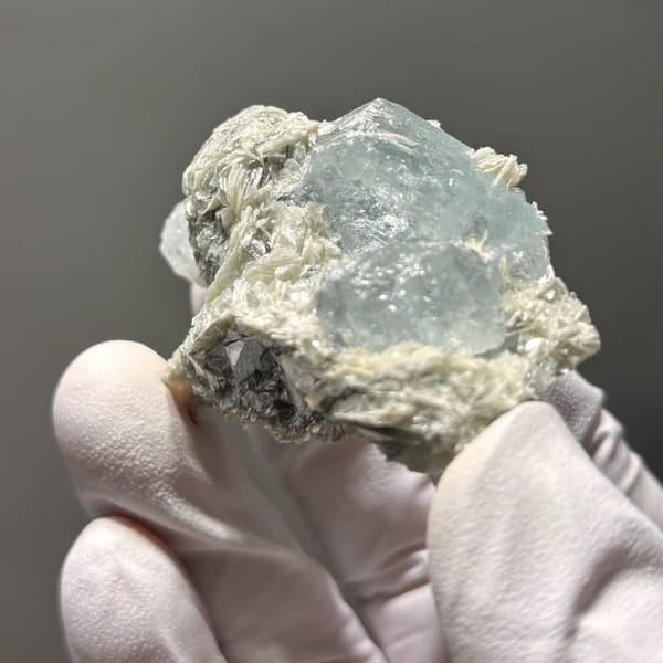 Surface-worn Xuebaoding aquamarine — complete view