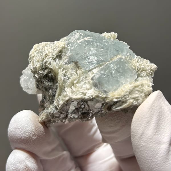 Surface-worn Xuebaoding aquamarine — detail view