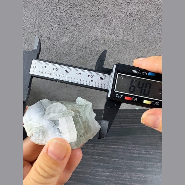 Pale green fluorite with frosted white bladed calcite from Fujian — detail view