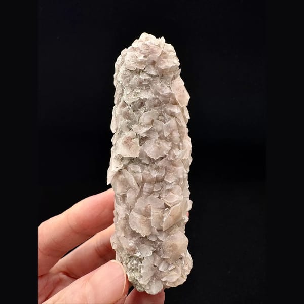 Quartz floater covered in pink and white petal calcite from Inner Mongolia — complete view