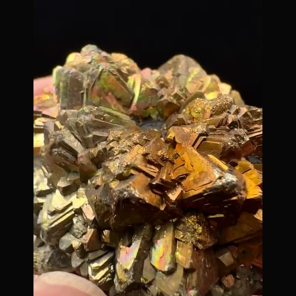 Round pyrite after marcasite ball with iridescent tarnish from Pakistan — detail view
