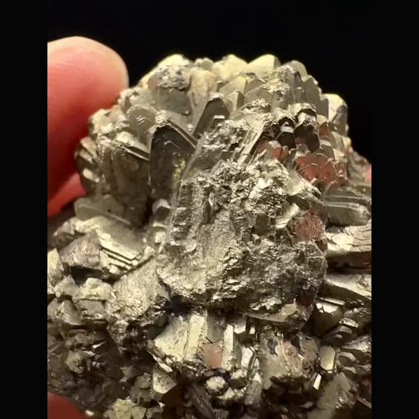 Round pyrite after marcasite ball with iridescent tarnish from Pakistan — detail view